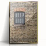 Framed acrylic print featuring a large, mid-century modernist abstract design in gold and black tones.