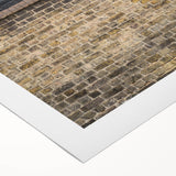 Art deco poster featuring geometric patterns in gold and black on rolled canvas, suitable for dining room decor.