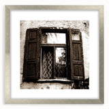 Textured abstract art print in neutral shades on a framed canvas, suitable for bedroom decor.