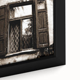 Close-up of textured black wall art with colorful abstract patterns, framed canvas, ideal for living room decor.