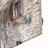 Large abstract wall art in vibrant orange and blue tones on acrylic glass.