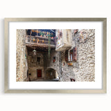 Textured abstract art print in silver frame, showcasing swirling gray patterns on canvas, suitable for bedroom decor.