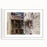 Abstract art print featuring swirling blue and gray tones on a white framed canvas, suitable for dining room or bedroom.