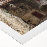 Art deco poster featuring geometric patterns in gold and black on a rolled canvas, suitable for dining room decor.