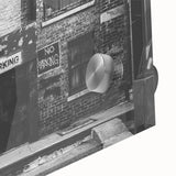 Large abstract wall art in vibrant orange and blue hues on acrylic glass, suitable for dining room decor.