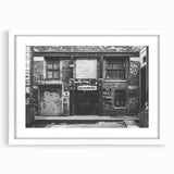 Abstract art print featuring swirling blue and gray patterns on a white framed canvas.