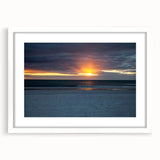 Abstract art print featuring swirling patterns in muted gray and blue tones on a framed canvas.