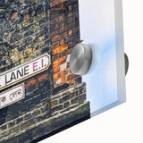 Large abstract wall art in vibrant orange and blue hues on acrylic glass.