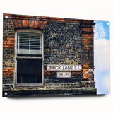 Large abstract wall art on acrylic glass, featuring swirling blues and whites, suitable for bedroom or dining room decor.