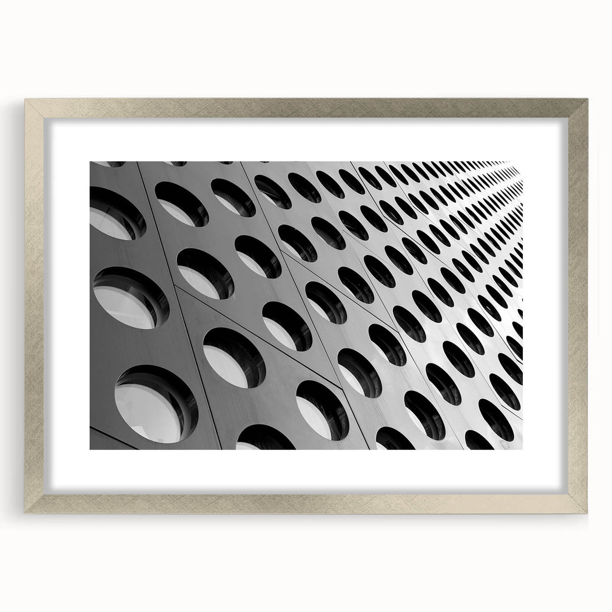 Abstract art print featuring swirling blue and silver hues on a framed canvas, suitable for modern dining room decor.