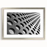 Abstract art print featuring swirling blue and silver hues on a framed canvas, suitable for modern dining room decor.