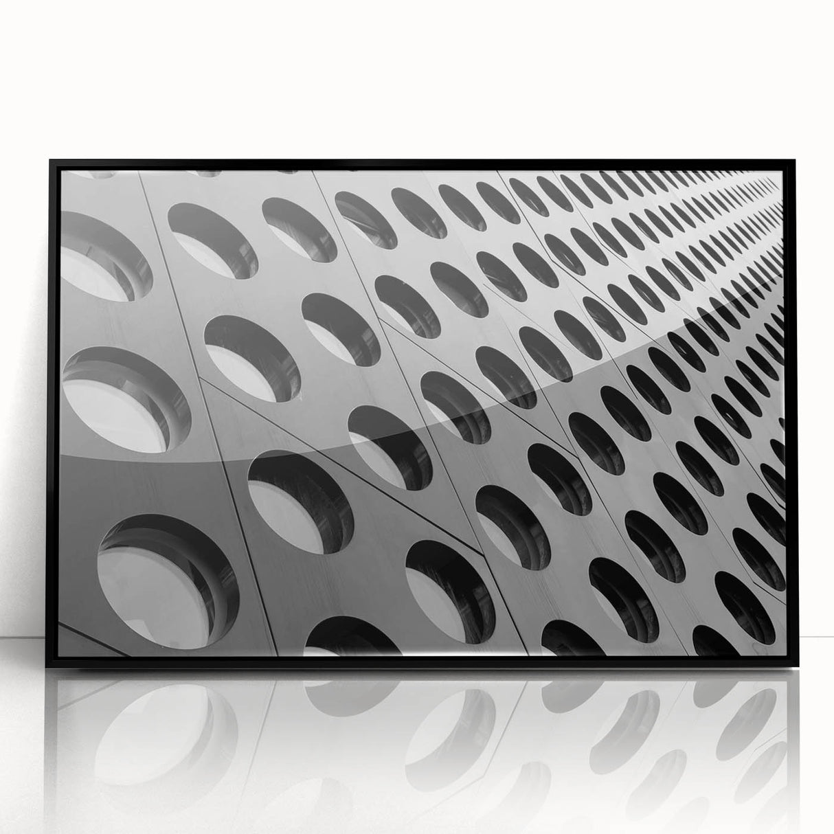 Large abstract wall art in muted grays and blues on a framed acrylic, ideal for modern living room decor.