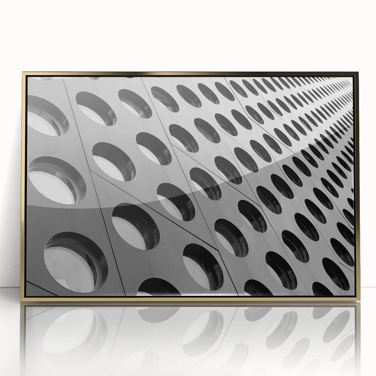 Mid-century modernist art deco poster in acrylic frame, featuring geometric shapes in gold and black.