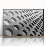 Mid-century modernist art deco poster in acrylic frame, featuring geometric shapes in gold and black.