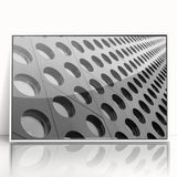 Large art print of a mid-century modernist abstract design in muted earth tones on a framed acrylic.