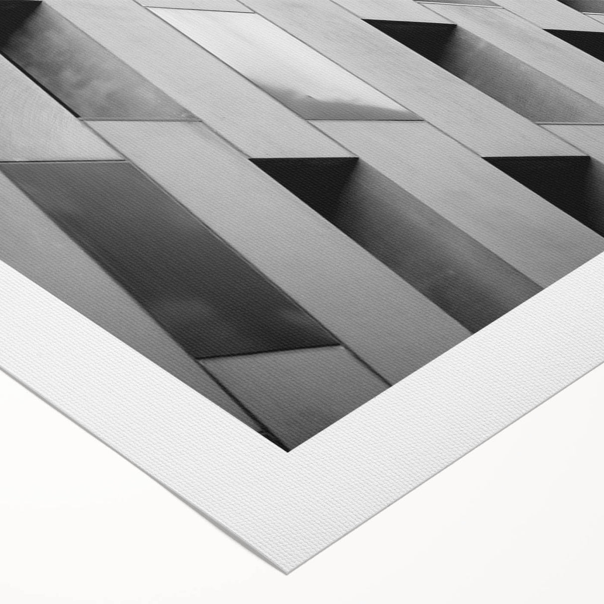 Art deco poster featuring geometric patterns and metallic gold and black tones on rolled canvas.