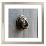 Textured abstract art print in silver frame, featuring swirling gray patterns, ideal for modern bedroom decor.