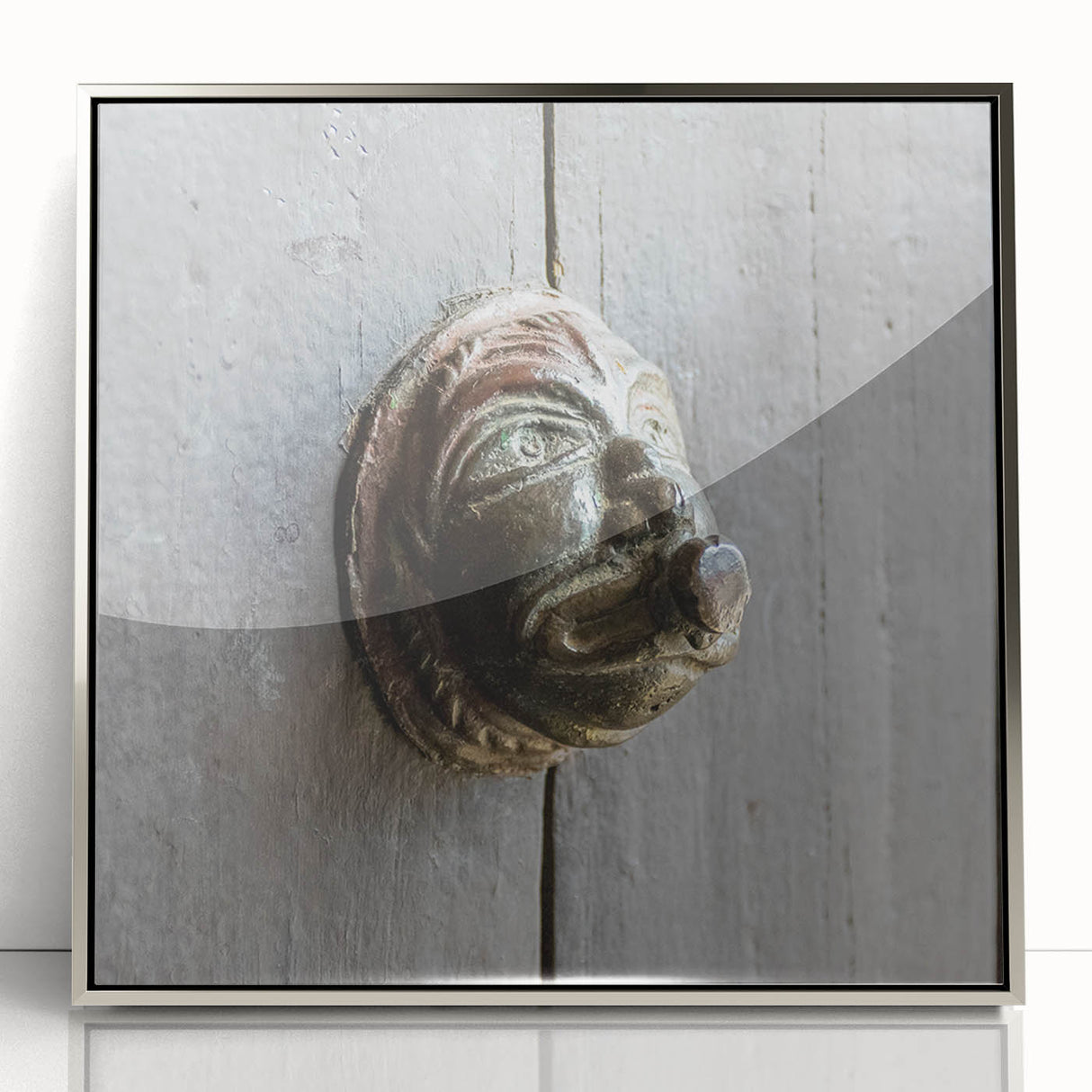 Mid-century modernist art depicting geometric shapes in muted earth tones on a framed acrylic print.