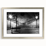 Textured abstract art print in muted gray and blue tones on a framed canvas, ideal for modern bedroom ambiance.