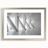 Abstract art print featuring swirling blue and gray tones on a framed canvas, suitable for bedroom or dining room decor.