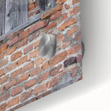 Large abstract wall art in vibrant orange and blue tones on acrylic glass.