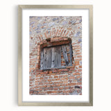 Textured abstract art print in neutral shades, displayed in a silver frame, ideal for modern bedroom ambiance.