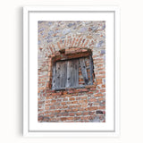 Abstract art print featuring swirling blue and white patterns, framed in white, suitable for bedroom or dining room decor.