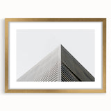 Textured abstract art print in muted gold and white tones on a framed canvas, suitable for bedroom decor.