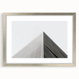 Abstract art print featuring swirling blue and gray patterns on a framed canvas, suitable for dining room or bedroom decor.