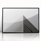 Large abstract wall art featuring swirling blue and gray tones on a framed acrylic, ideal for modern living room decor.