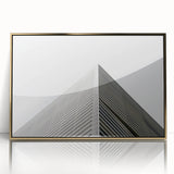 Mid-century modernist art deco poster featuring geometric shapes in gold and black, framed acrylic.