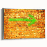 Framed canvas of a vintage landscape painting featuring colorful rolling hills under a stormy sky.