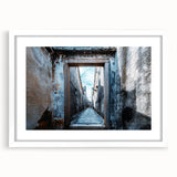 Abstract art print featuring swirling blue and gray patterns on a white framed canvas.