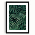 Black-framed artwork featuring an abstract landscape design, mounted with a white mat, showcasing a modern aesthetic ideal for contemporary home decor.