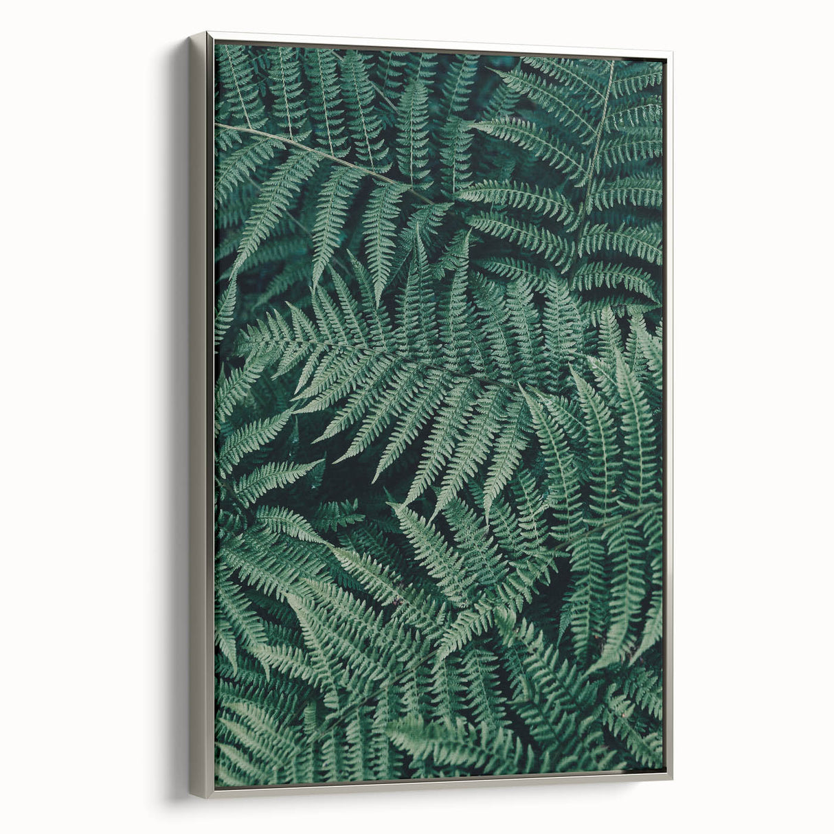 Framed canvas artwork showcasing an elegant abstract design in vibrant colors, displayed with a sleek silver frame, perfect for modern home decor or office settings.