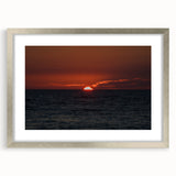 Textured abstract art print in muted gray and silver tones, presented in a silver frame, ideal for modern bedroom ambiance.