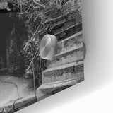 Large abstract wall art in vibrant orange and blue tones on acrylic glass, suitable for dining room ambiance.