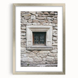 Textured abstract art print in silver frame, featuring swirling blue and gray tones, ideal for modern bedroom ambiance.