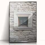 Mid-century modernist art featuring geometric shapes in muted pastel colors on a silver-framed acrylic print.