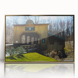 Large art print of a mid-century modernist abstract design in gold and black tones on framed acrylic.