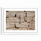 Abstract art print featuring swirling blue and gray tones on a white framed canvas.