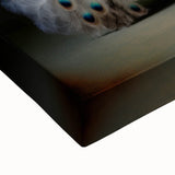 Close-up of a stretched canvas displaying vibrant African wall art, showcasing intricate tribal patterns and textures, ideal for home decor and gallery displays.