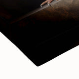 Close-up view of a stretched canvas displaying vibrant abstract artwork in bold colors, highlighting the texture and craftsmanship, ideal for modern home decor.