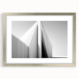 Abstract art print featuring swirling blue and gray tones on a framed canvas, suitable for dining room or bedroom decor.