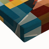 Close-up of a stretched canvas artwork showcasing vibrant abstract patterns in rich blues and golds, highlighting its textured surface and artistic details.