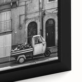 Close-up of textured black wall art on canvas featuring colorful abstract patterns, ideal for living room decor.