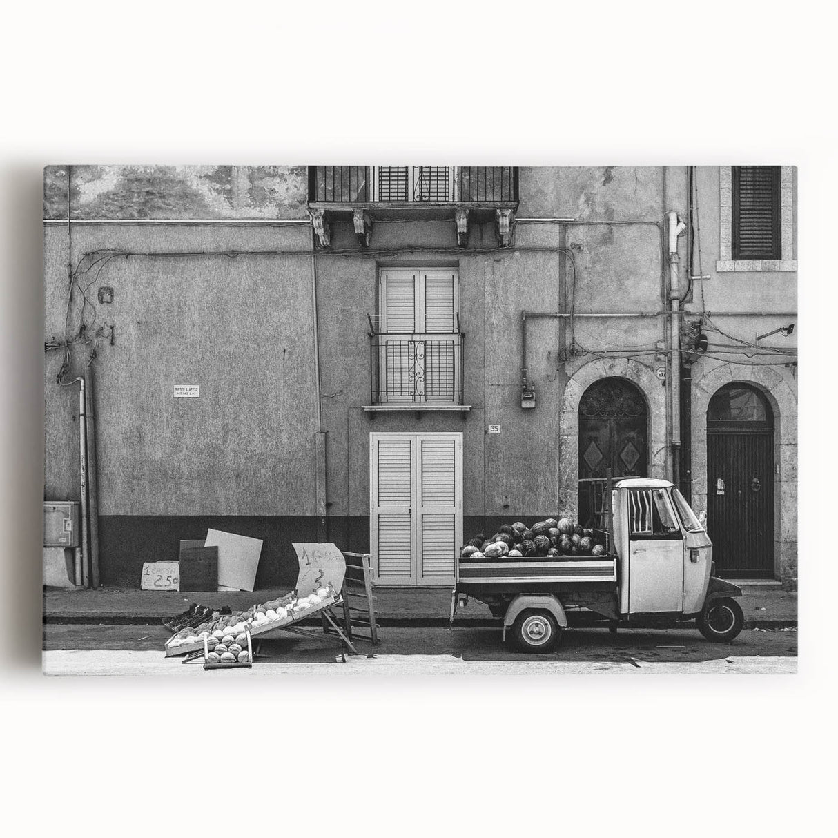 Large black and white abstract print on stretched canvas, featuring dynamic brush strokes, ideal for kitchen wall art.