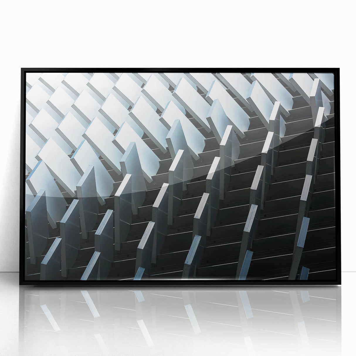 Large abstract wall art featuring swirling blue and gray tones on a framed acrylic print.