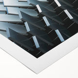 Art deco poster featuring geometric patterns in muted gold and navy, printed on rolled canvas.