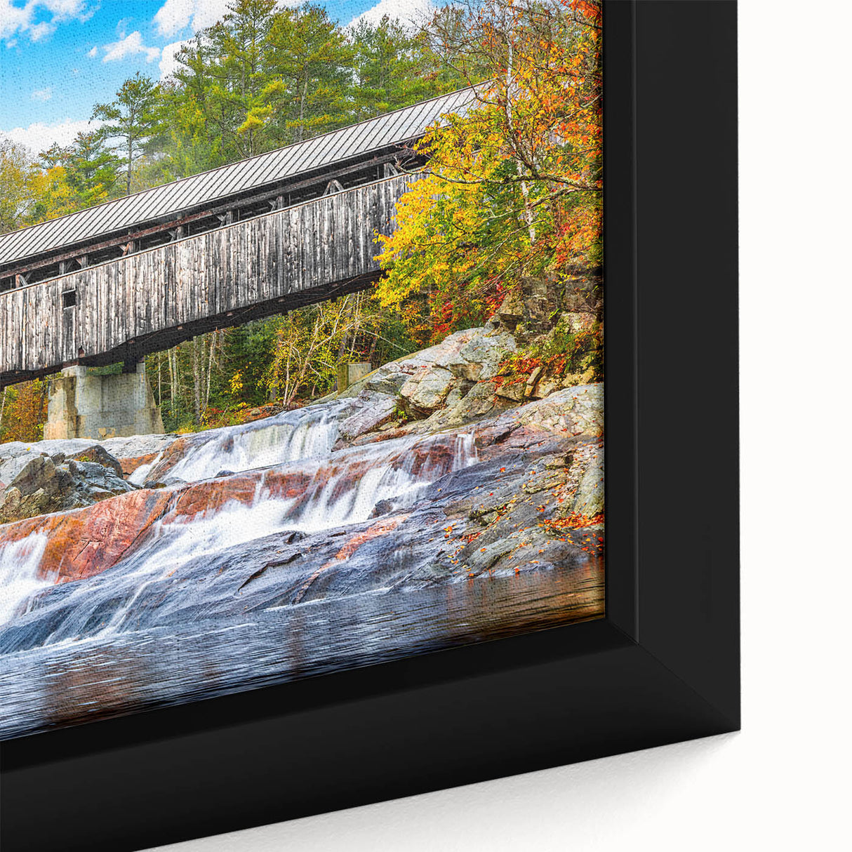 Close-up of textured black wall art on canvas featuring vibrant, colorful abstract patterns.